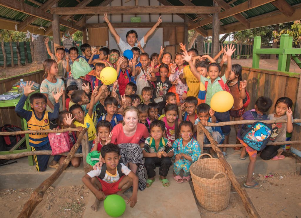 5 Reasons to Volunteer Abroad 1 cambodia school Group photo of participant with students