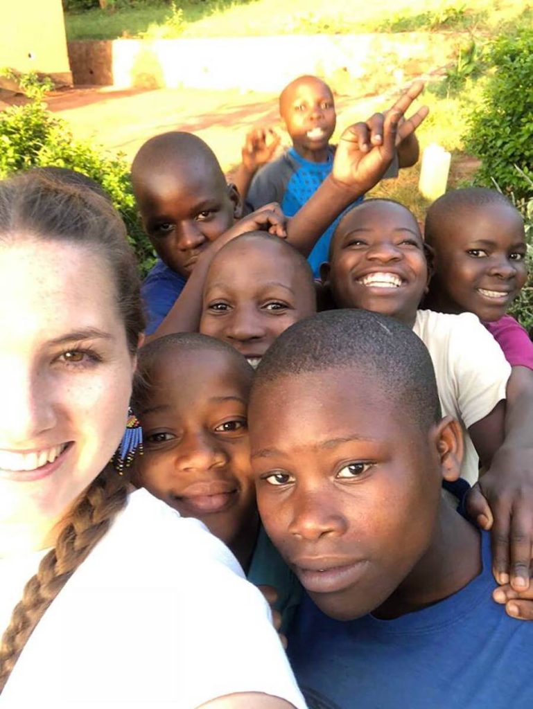 UgandaParticipants and school kids take selfie UgandaParticipants and school kids take selfie